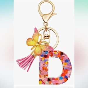 Initial D confetti initial purse charm with butterfly and tassel clips on